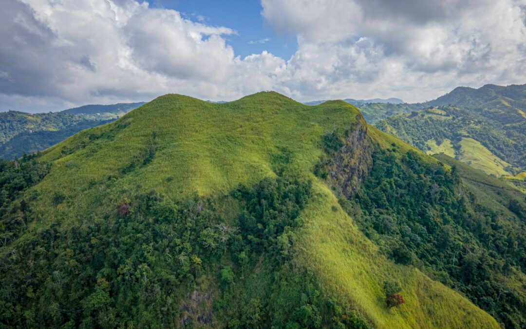 Green hillside in Puerto Rico with blue skies